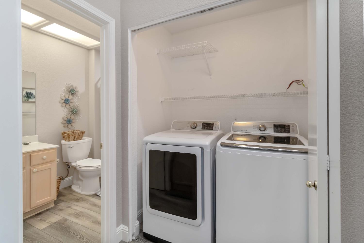 7597 Timberrose Way Roseville, CA 95747 - Photo 22 of 30 a view of bathroom with a toilet sink and mirror