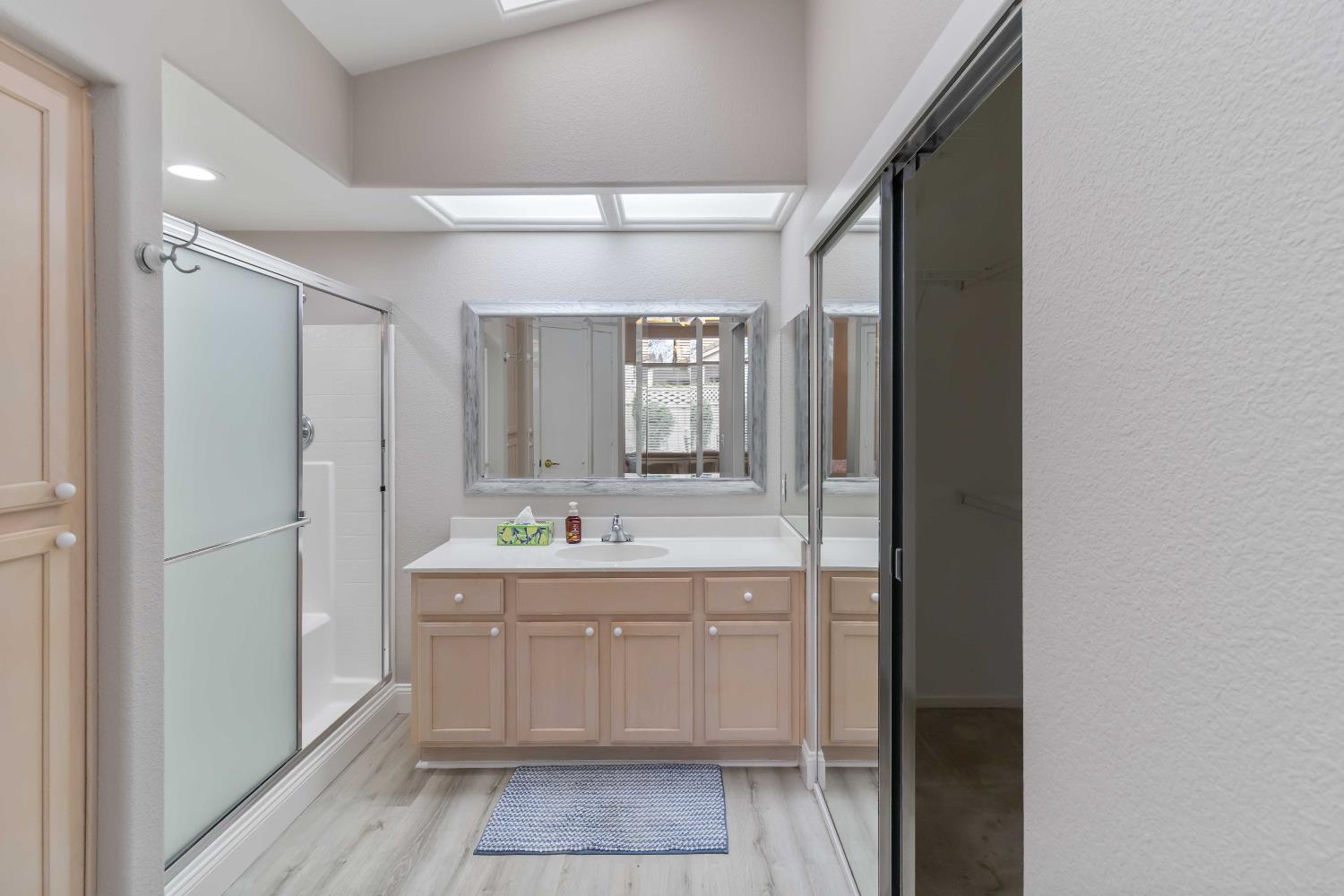 7597 Timberrose Way Roseville, CA 95747 - Photo 26 of 30 a spacious bathroom with a double vanity sink and mirror