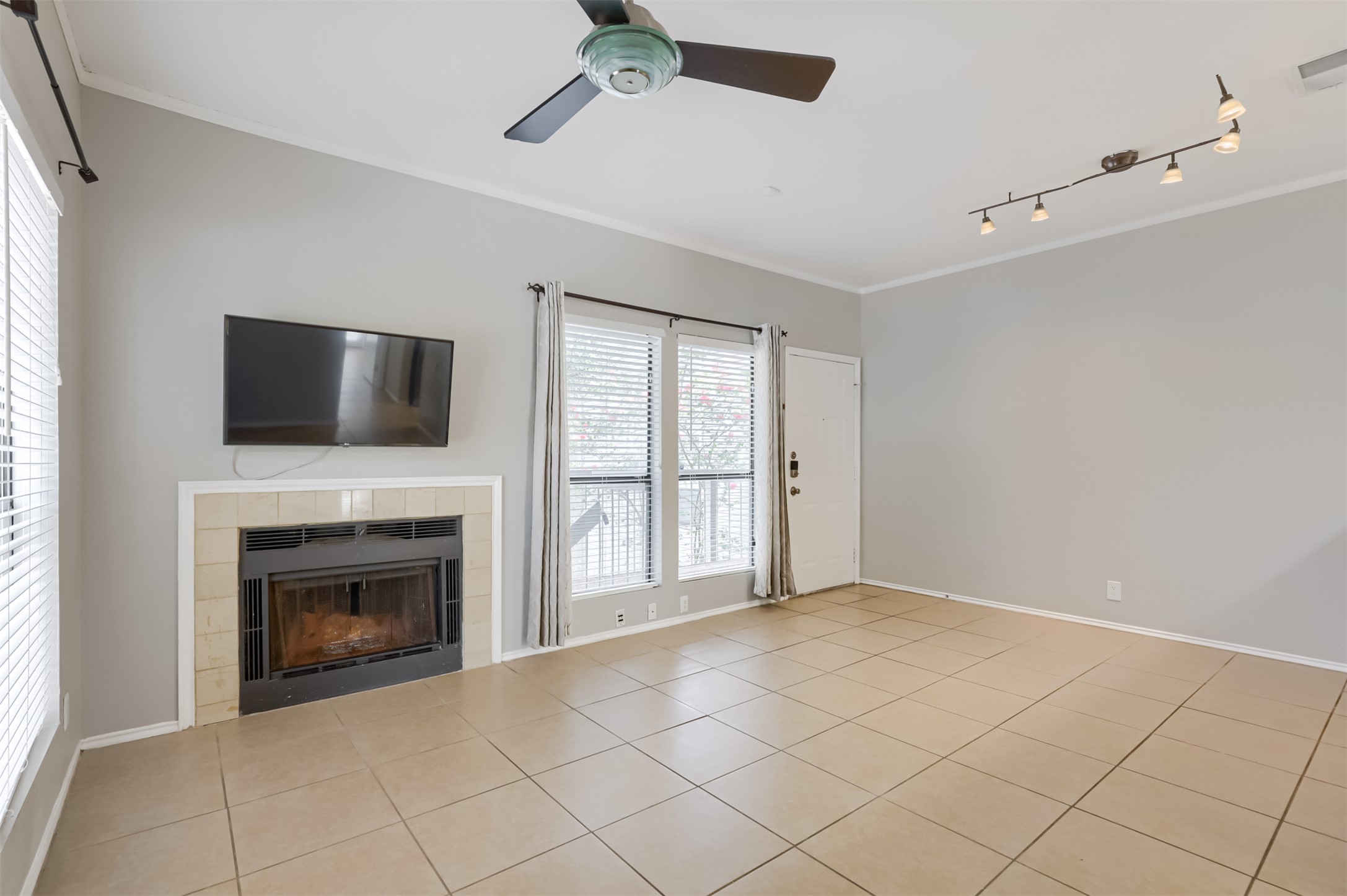 802 South 1st Street, Unit 206 Austin, TX 78704 - Photo 2 of 18 a view of an empty room with a fireplace and a window