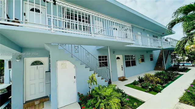 a view of a kitchen with stainless steel appliances cabinets and a sink