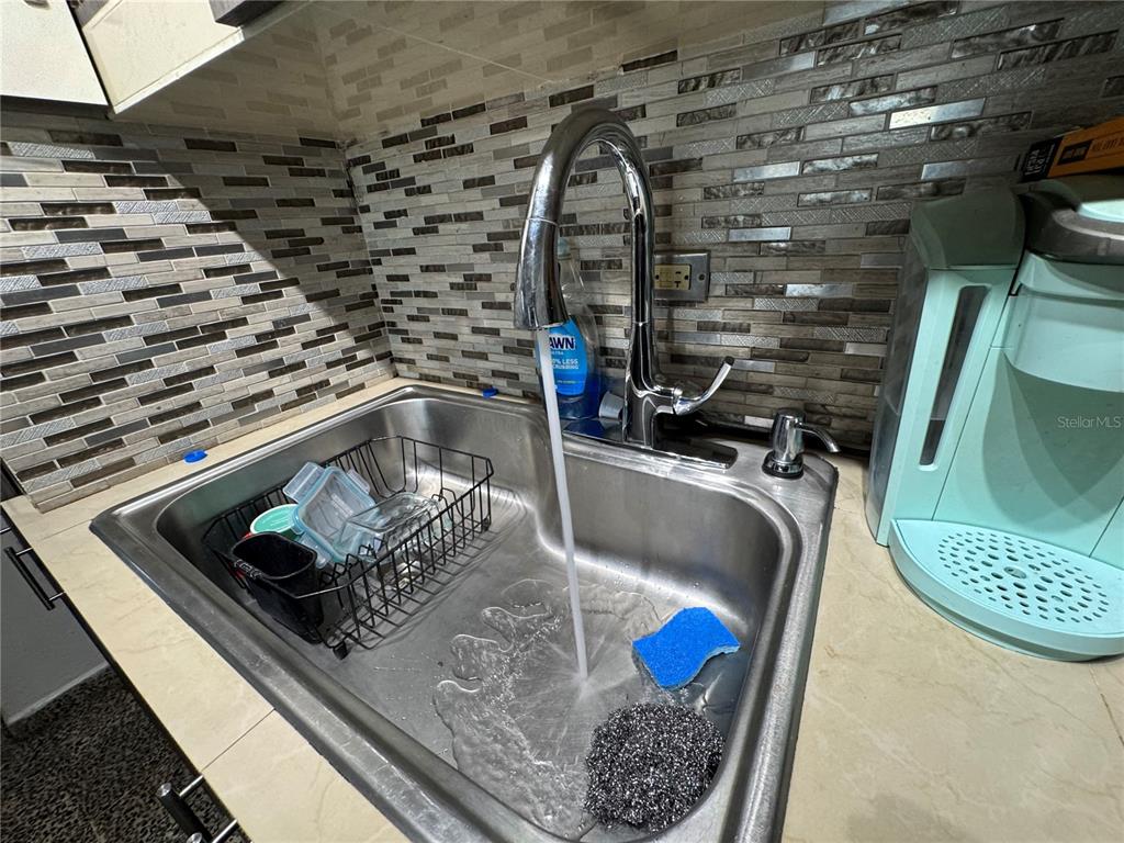 140 Km 38.9 Utuado, Utuado 00641 - Photo 30 of 55 a kitchen with a sink and a stove