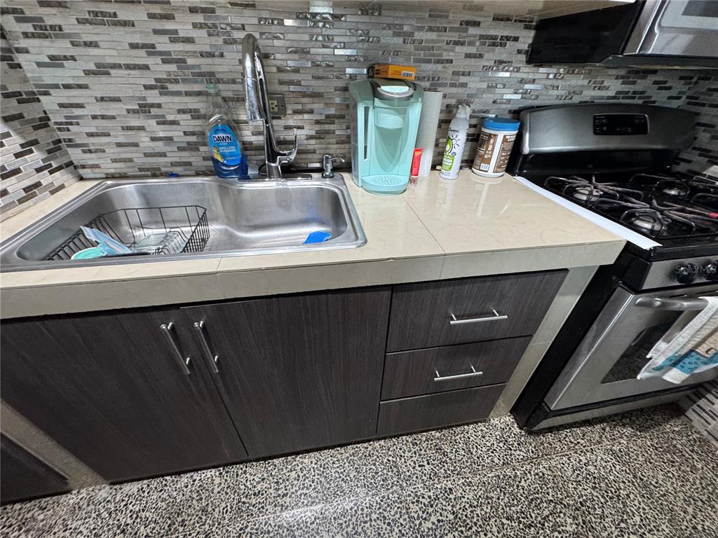 140 Km 38.9 Utuado, Utuado 00641 - Photo 31 of 55 a kitchen with a sink and cabinets
