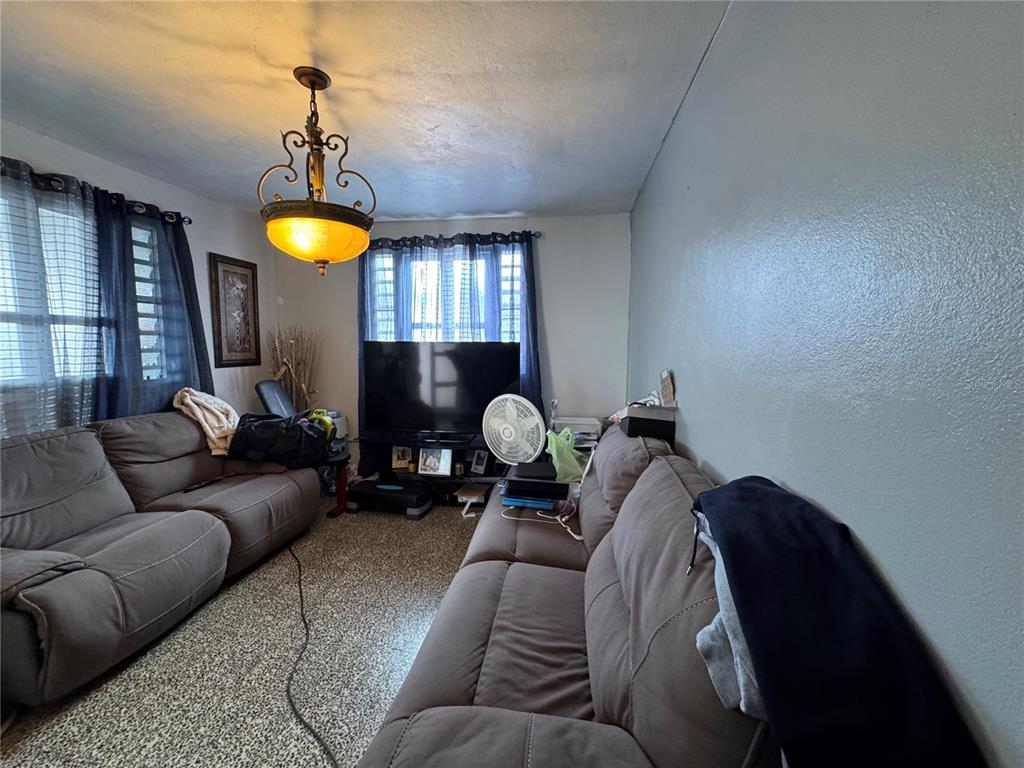 140 Km 38.9 Utuado, Utuado 00641 - Photo 39 of 55 a living room with furniture and a table