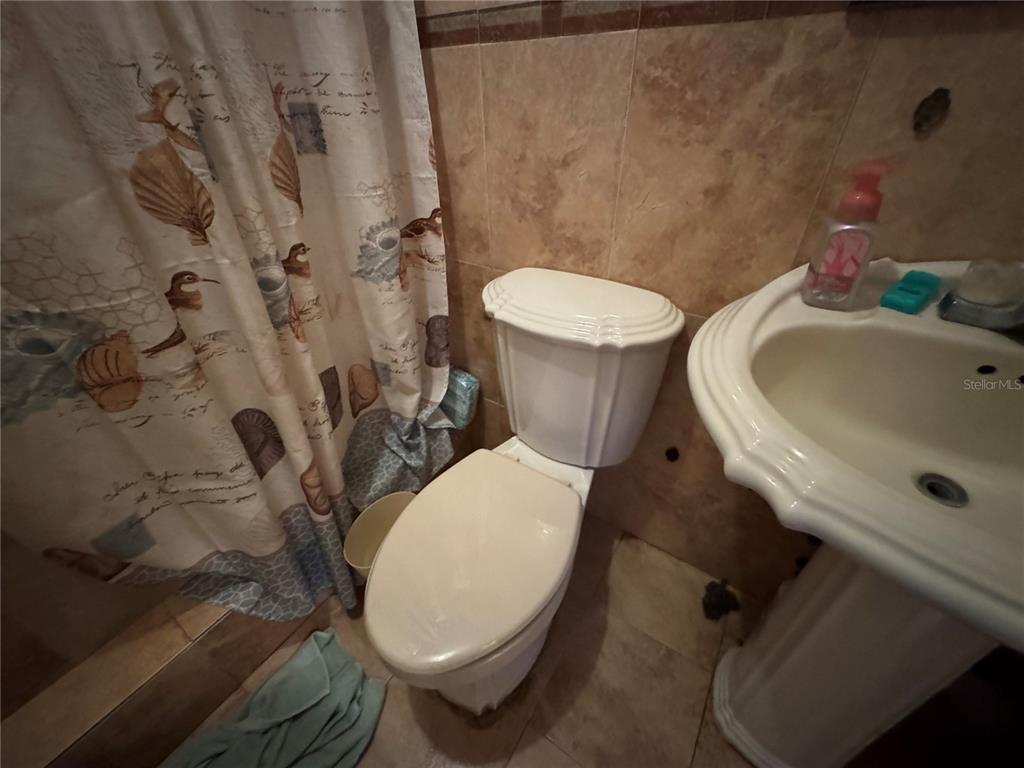 140 Km 38.9 Utuado, Utuado 00641 - Photo 44 of 55 a white toilet sitting next to a bathroom sink and tub