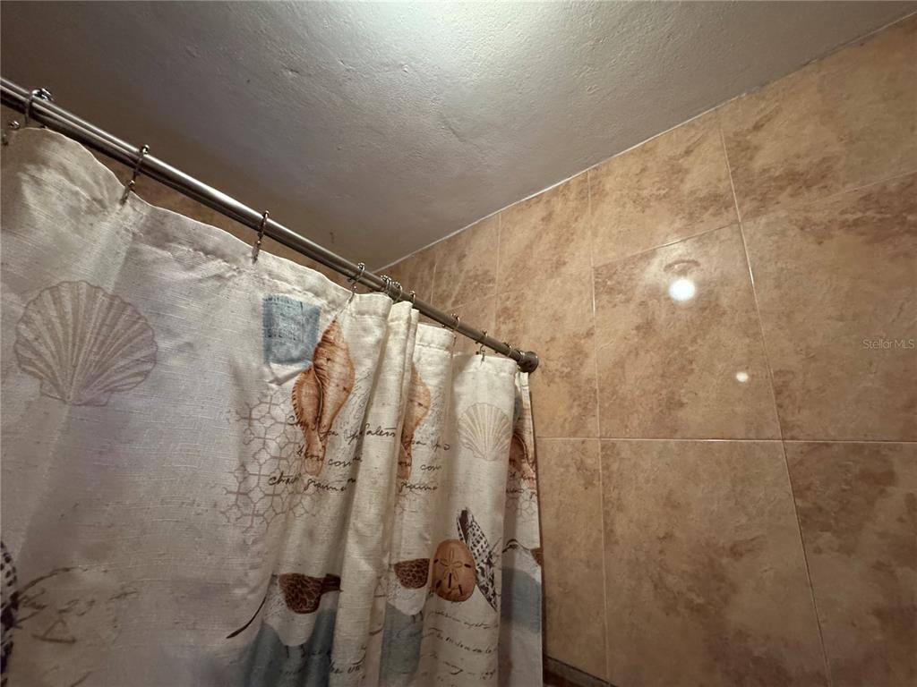 140 Km 38.9 Utuado, Utuado 00641 - Photo 45 of 55 a bathroom with a shower and a mirror