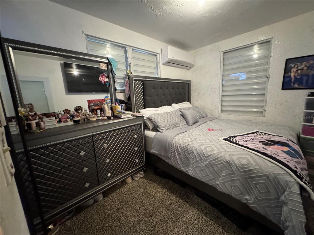 140 Km 38.9 Utuado, Utuado 00641 - Photo 46 of 55 a bedroom with a bed and flat screen tv