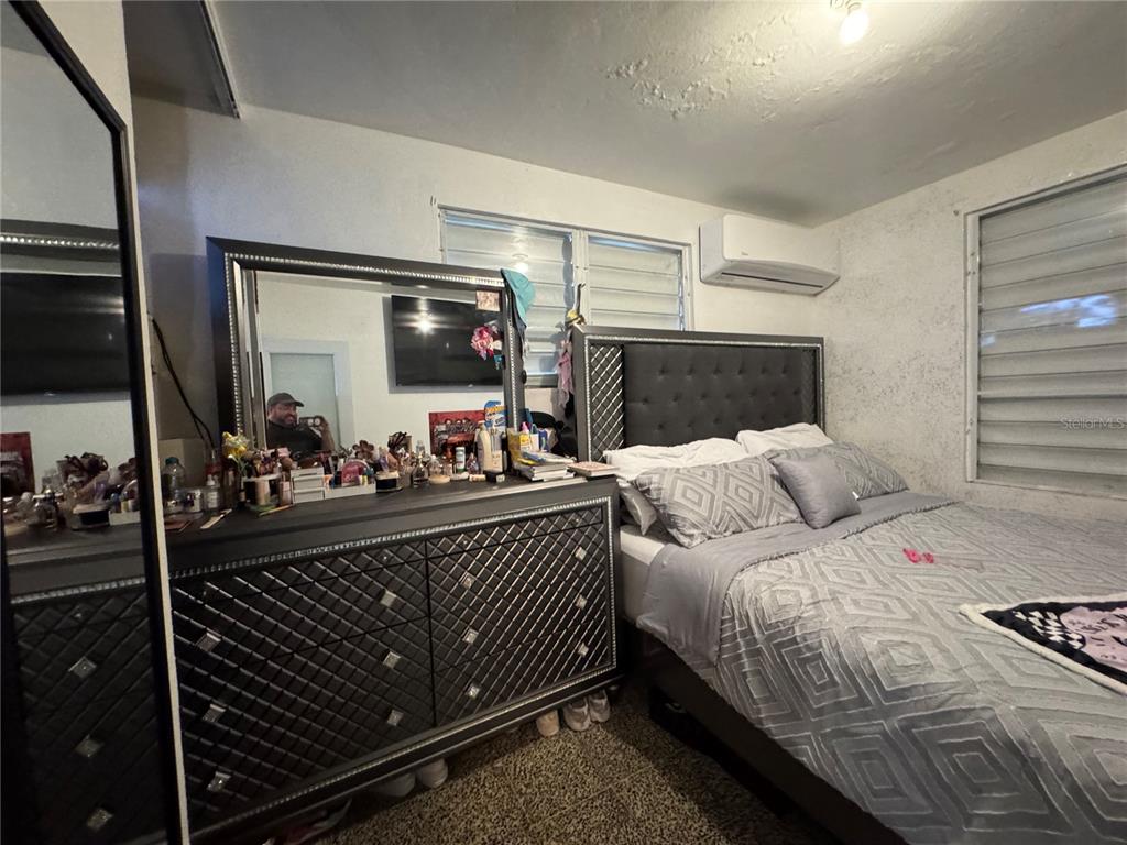 140 Km 38.9 Utuado, Utuado 00641 - Photo 50 of 55 a bed room with a bed window and a mirror