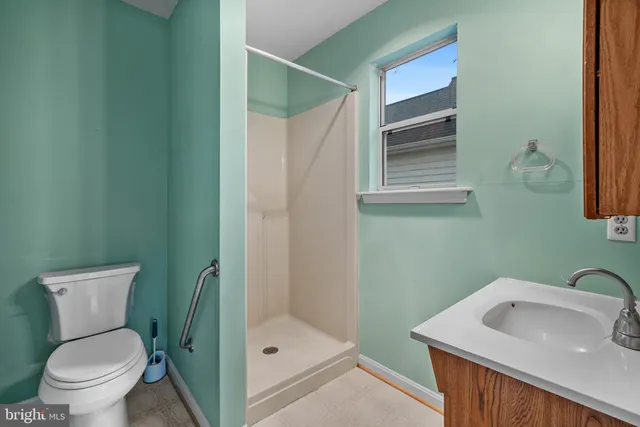 a bathroom with a sink and toilet