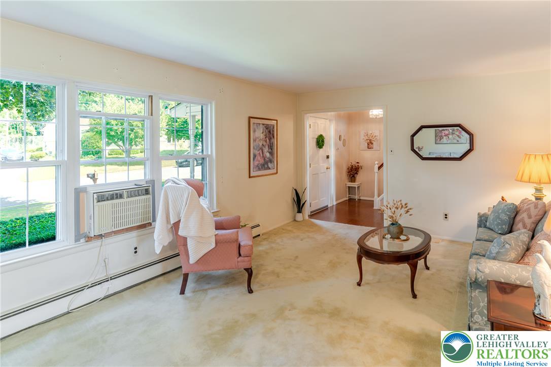 2130 Wisteria Road Lower Macungie Township, PA 18062 - Photo 9 of 48 A window-lined living area provides views of the surrounding greenery.
