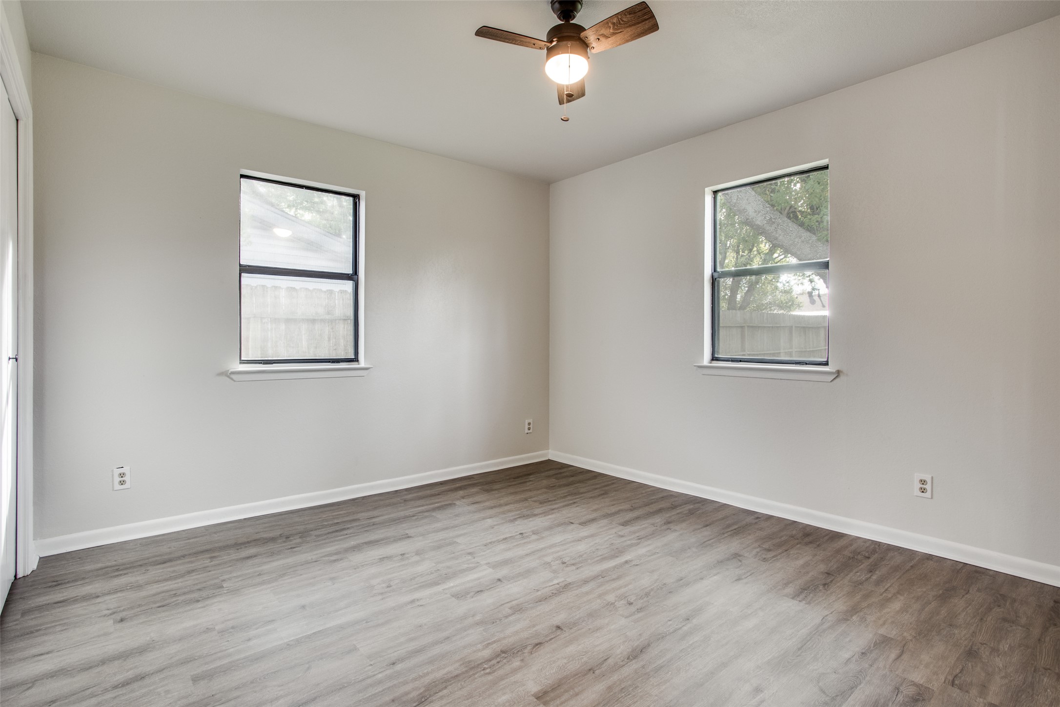 2212 Rifle Bend Drive Georgetown, TX 78626 - Photo 12 of 15 a view of an empty room with wooden floor and a window