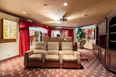 a kitchen with kitchen island granite countertop wooden cabinets and a counter top space