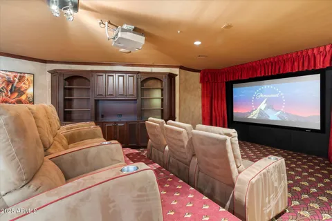 a kitchen with kitchen island granite countertop a sink a counter top space and cabinets