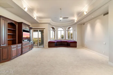 a bathroom with a granite countertop sink a mirror and a shower