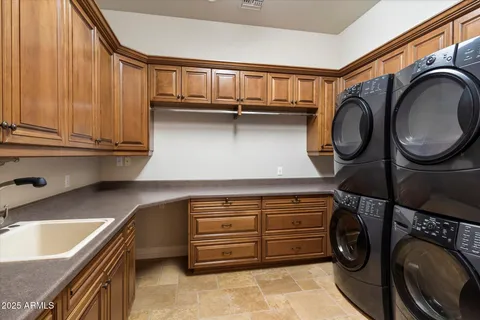 a view of a backyard with table and chairs and a fire pit