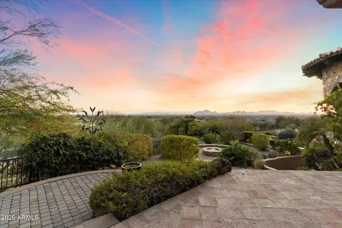 a view of a balcony with wooden floor and outdoor seating