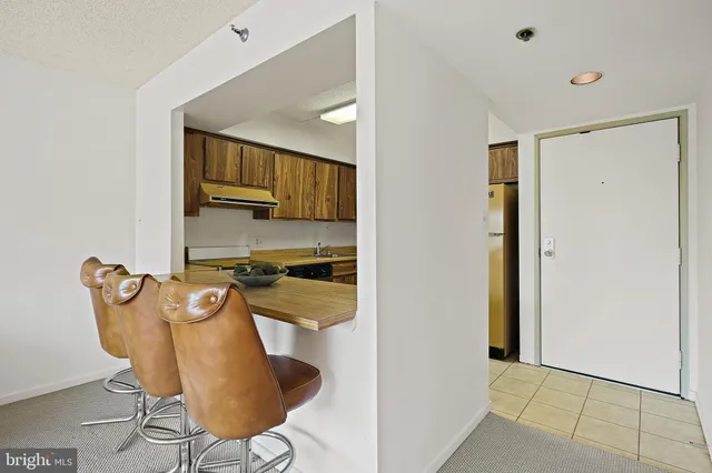 a view of a kitchen with chair and table