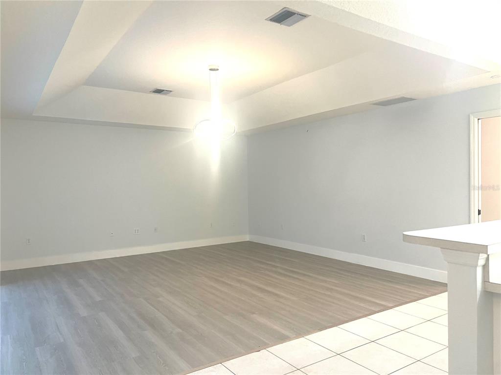 378 Roseling Circle Venice, FL 34293 - Photo 8 of 8 an empty room with a workbench