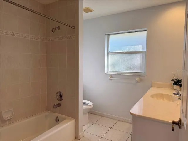 a bathroom with a sink a toilet and bathtub