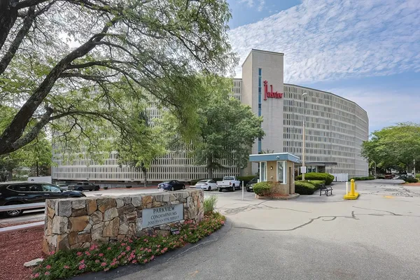 a backyard of a house with barbeque oven and outdoor seating
