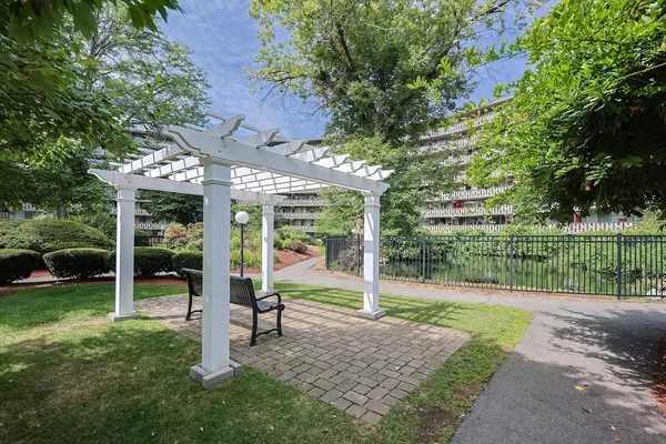 a view of a backyard with pathway