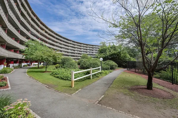 a view of a swimming pool with a yard