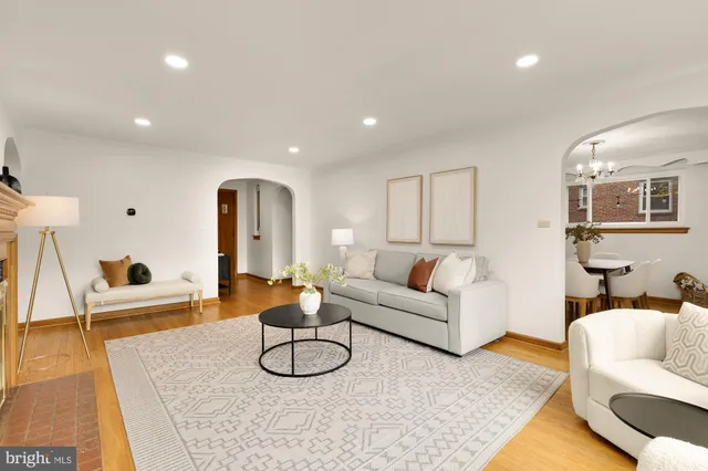 a dining room with furniture and wooden floor