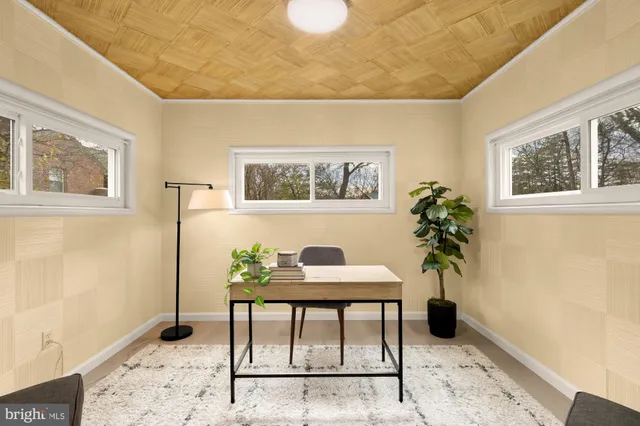 a workspace with furniture and window