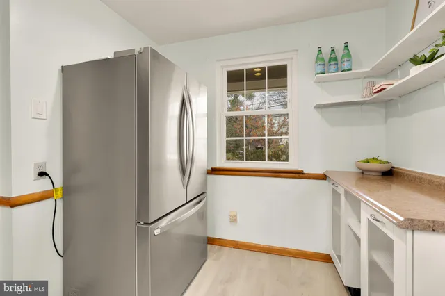 a kitchen with a sink stove and microwave