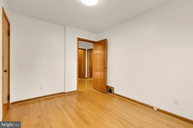 a bedroom with a bed and a chair