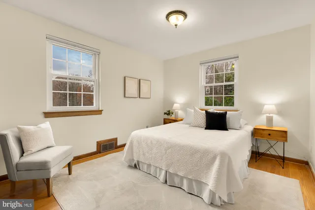 a spacious bedroom with a bed and a window