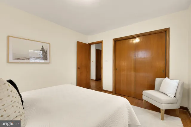a view of a bedroom with window and tub