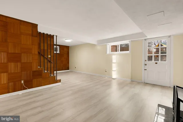 a bathroom with a sink mirror and toilet