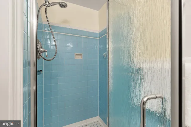 a white house with a big yard and large trees