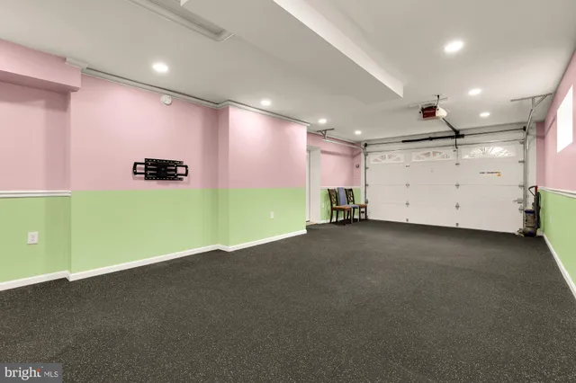 a front view of a house with yard and green space