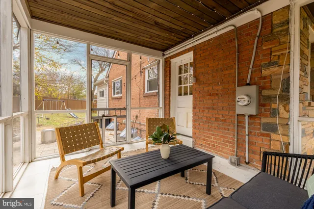 a outdoor living space with furniture and a potted plant
