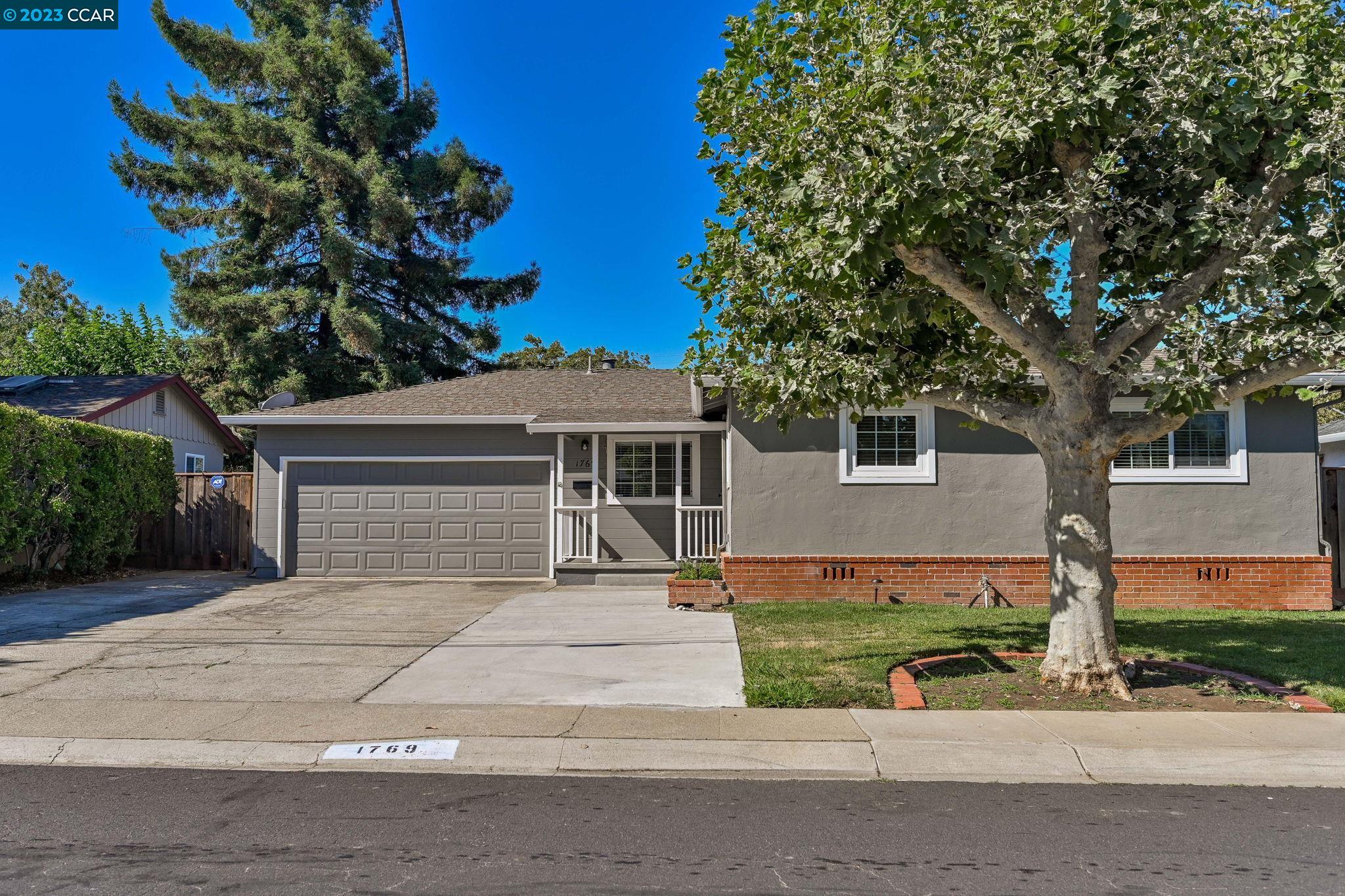 front view of a house with a small yard