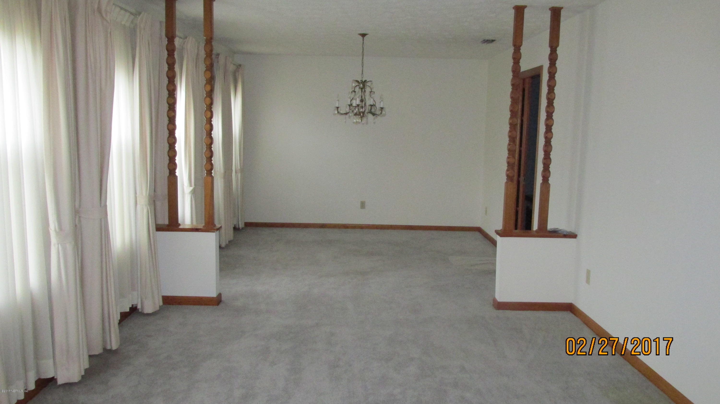 6514 Immokalee Road Keystone Heights, FL 32656 - Photo 2 of 10 an empty room with windows