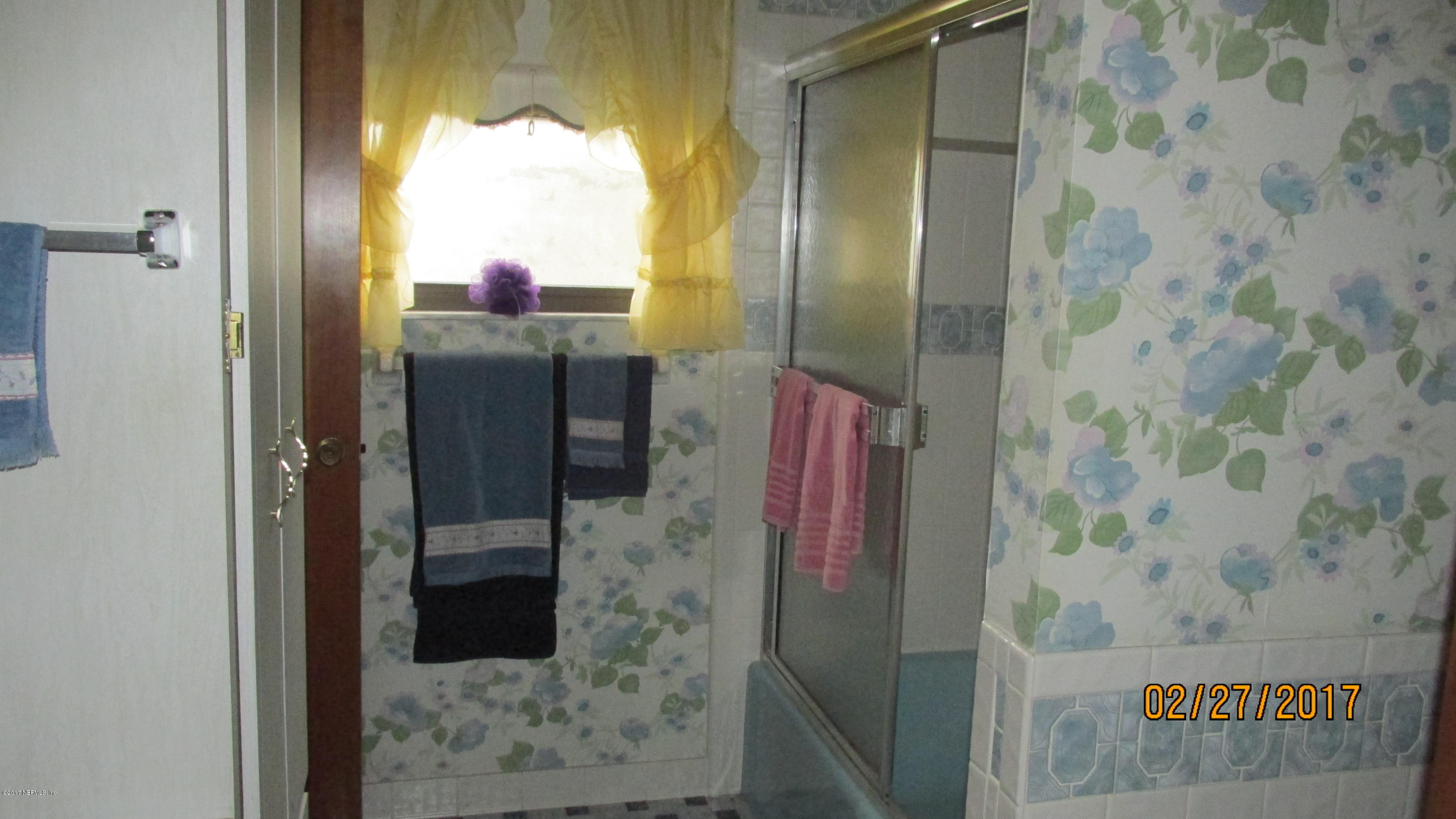 6514 Immokalee Road Keystone Heights, FL 32656 - Photo 7 of 10 a bathroom with a shower