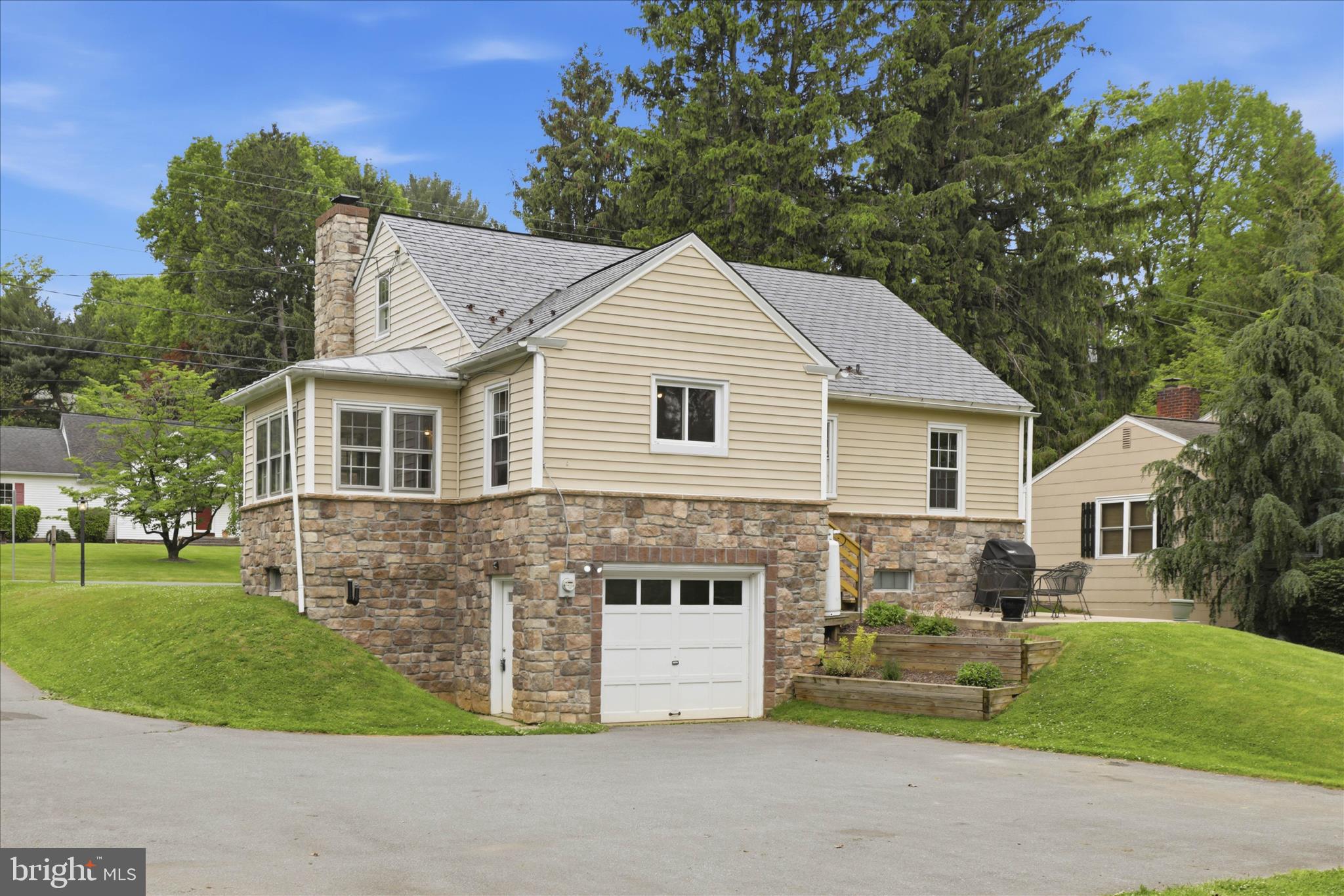 169 School House Road Lancaster, PA 17603 - Photo 32 of 39 a front view of a house with a garden and trees