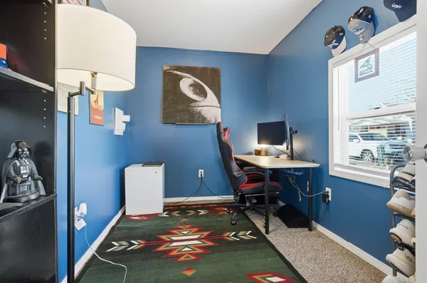 a workspace with furniture and a window