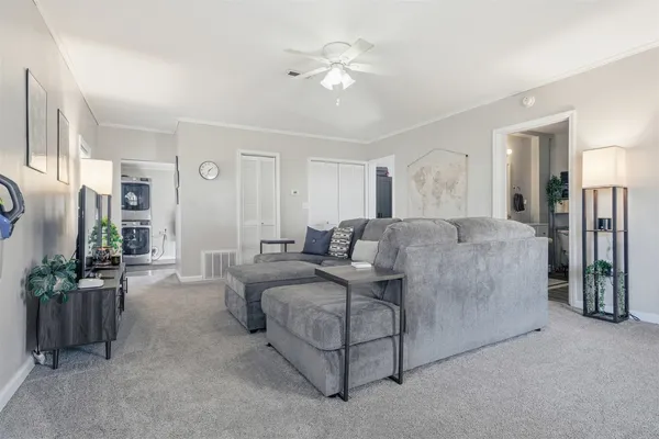 a living room with furniture and flat screen tv