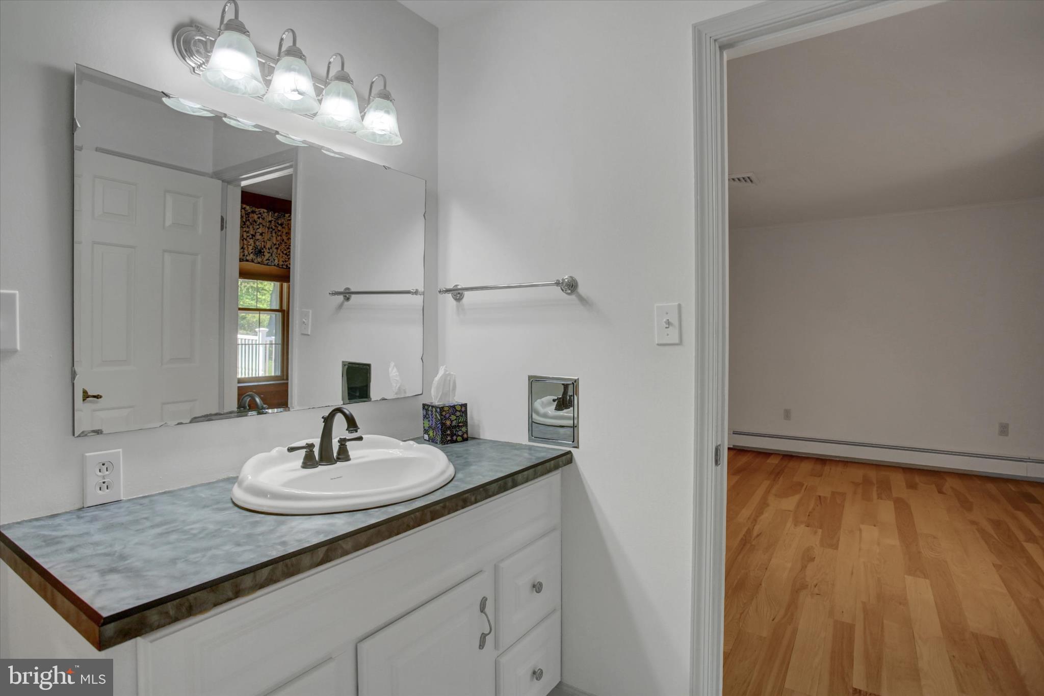 98 Peach Glen Road Gardners, PA 17324 - Photo 29 of 85 a bathroom with a sink and a mirror