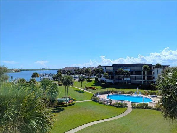 a view of a swimming pool with outdoor seating