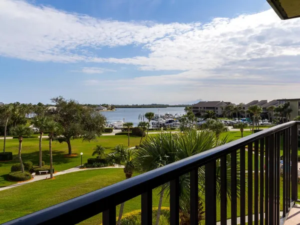 a view of empty room with chandelier fan and window