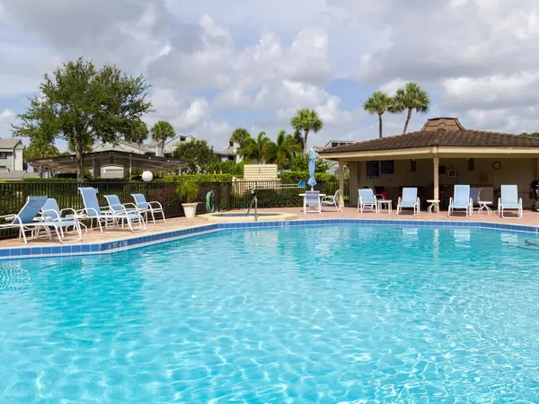 a view of a swimming pool and a chair