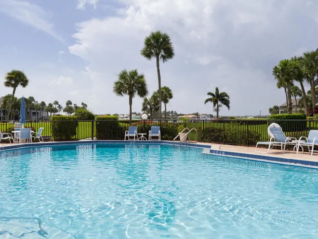a view of a swimming pool and a chair