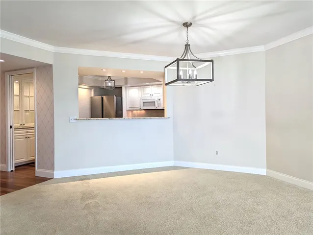 a view of a room with wooden floor and windows