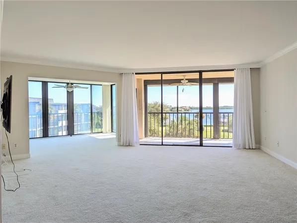 an empty room with large windows