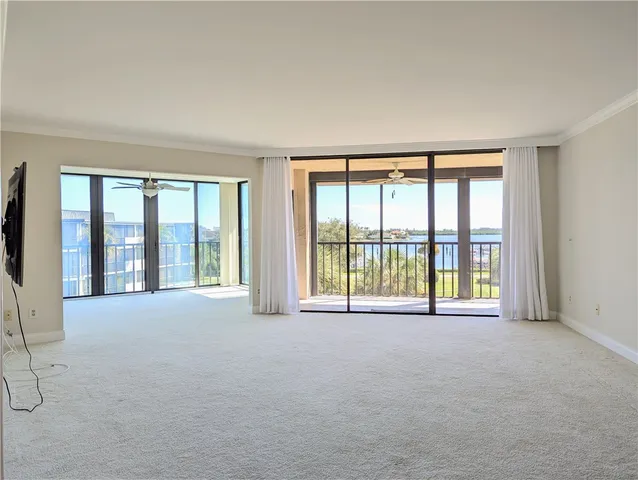 a view of an empty room with a balcony