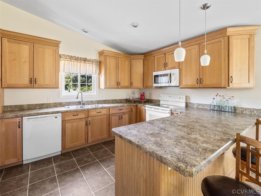 10417 River Road Petersburg, VA 23803 - Photo 11 of 29 a kitchen with a sink a stove a microwave cabinets and a window